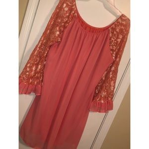 Coral dress with lace sleeves